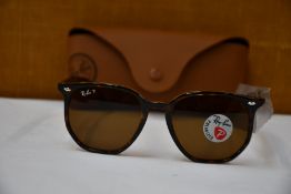 A pair of as new Ray Ban sunglasses.