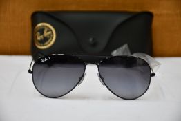 A pair of as new Ray Ban sunglasses.
