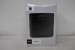 A boxed as new soft black 5v Bose Soundlink Colour ll speaker. (Factory sealed).