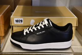 A pair of as new Michael Kors Keating trainers (US 7M).
