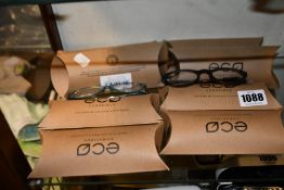 Eight pairs of assorted as new Eco Conscious glasses frames.