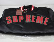 An as new Supreme x Mitchell and Ness varsity jacket (M).
