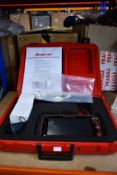 A pre-owned Snap-On Sollus Edge Diagnostics System with a case (Item powers on but is untested, no