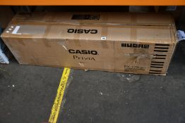 A Casio Privia PX-770 digital piano in black.
