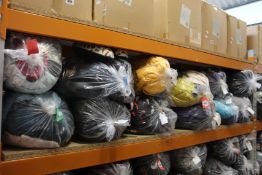 Twelve bags of assorted clothing and related items.