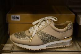 A pair of as new Michael Kors Allie Wrap trainers (US 7.5M).