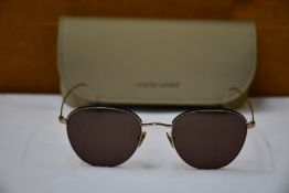 A pair of as new Giorgio Armani sunglasses.