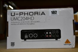 Two boxed as new Behringer U-Phoria UMC204HD mic preamplifiers.