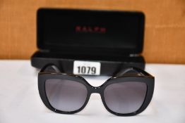 A pair of as new Ralph Lauren sunglasses.