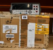 An as new Agilent 34410A 6½ Digit Digital Multimeter with test lead set, certificate of calibration,