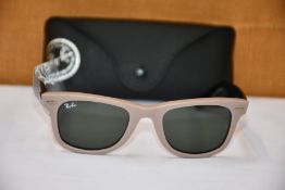 A pair of as new Ray Ban sunglasses.