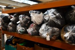 Twelve bags of assorted clothing and related items.