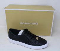 A pair of as new Michael Kors Keaton lace up sneakers (US 7M).