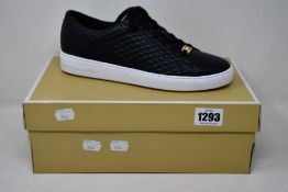 A pair of as new Michael Kors Keaton lace up sneakers (US 10M).