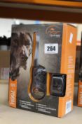 A boxed as new SportDOG SportTrainer 700M remote trainer.