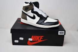 A pair of as new Nike Air Jordan 1 Retro High OG (UK 9).