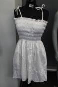 An an new Tory Burch smocked short dress in white (XS).