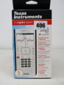 A boxed as new Texas Instruments TI-nspire NSPCX II-T Graphing Calculator.