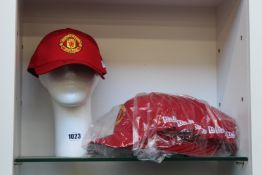 Twelve as new New Era Manchester United caps in red.