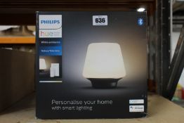 A Philips hue wellness table lamp.
