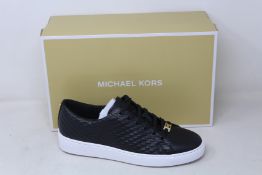 A pair of as new Michael Kors Keaton lace up sneakers (US 6.5M).