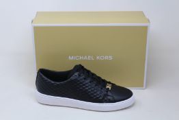 A pair of as new Michael Kors Keaton lace up sneakers (US 6.5M).