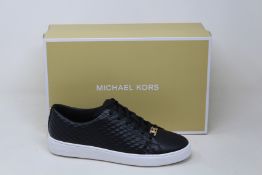 A pair of as new Michael Kors Keaton lace up sneakers (US 7.5M).