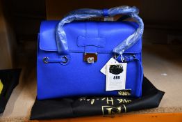 An as new Nova Harley Luxury Elegant Bluer leather changing bag.