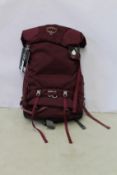 An as new Osprey Renn 65 Aurora backpack.