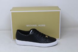 A pair of as new Michael Kors Keaton lace up sneakers (US 8.5M).