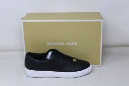 A pair of as new Michael Kors Keaton lace up sneakers (US 7.5M).