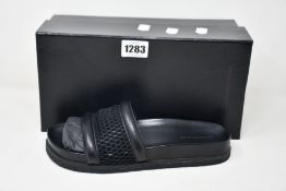 A pair of as new Alexander Wang slides in black (EU 39).