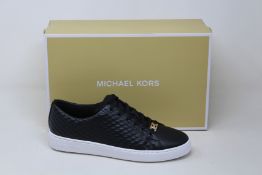 A pair of as new Michael Kors Keaton lace up sneakers (US 7M).