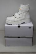 Two pairs of as new Caterpillar Reignite boots in white (Both UK 8 although one pair labelled as