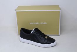 A pair of as new Michael Kors Keaton lace up sneakers (US 7M).