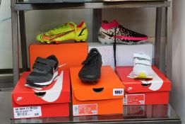 Five pairs of children's/youths assorted as new Nike footwear to include three pairs of football