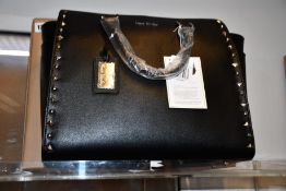 An as new Nova Harley Luxury Nevada leather changing bag.