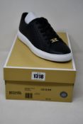A pair of as new Michael Kors Keaton lace up sneakers (US 9.5M).