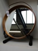 A round wall mirror by LUXUS Vittsjo Sweden.