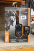 A boxed as new SportDOG SportTrainer 700M remote trainer.