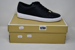 A pair of as new Michael Kors Keaton lace up sneakers (US 10M).