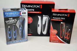 Three Remington grooming sets to include The Works, Ultimate and Power Pro.