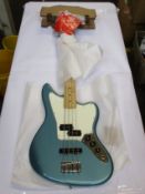 A Fender Player Jaguar Bass with maple fretboard in Tidepool.