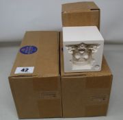 Two Modern Souvenir handmade Acanthus bookends and two Corinthian paperweights (One unboxed).