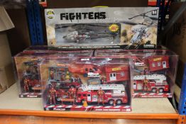Seven boxed as new Firefighter Action Team Emergency toy sets and a New York Gift Co Fighter Model
