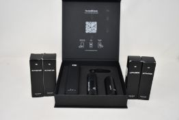 Four men's Copenhagen Grooming Activators (4 x 30ml) and a boxed Copenhagen Grooming beard growth