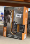 A boxed as new SportDOG SportTrainer 700M remote trainer.