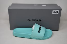 A pair of as new Balenciaga pool slides (EU 38).