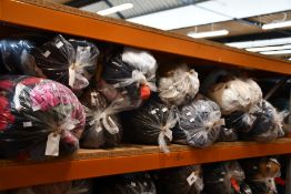 Eleven bags of pre-owned clothing and related items.