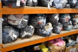 Eleven bags of pre-owned clothing and related items.